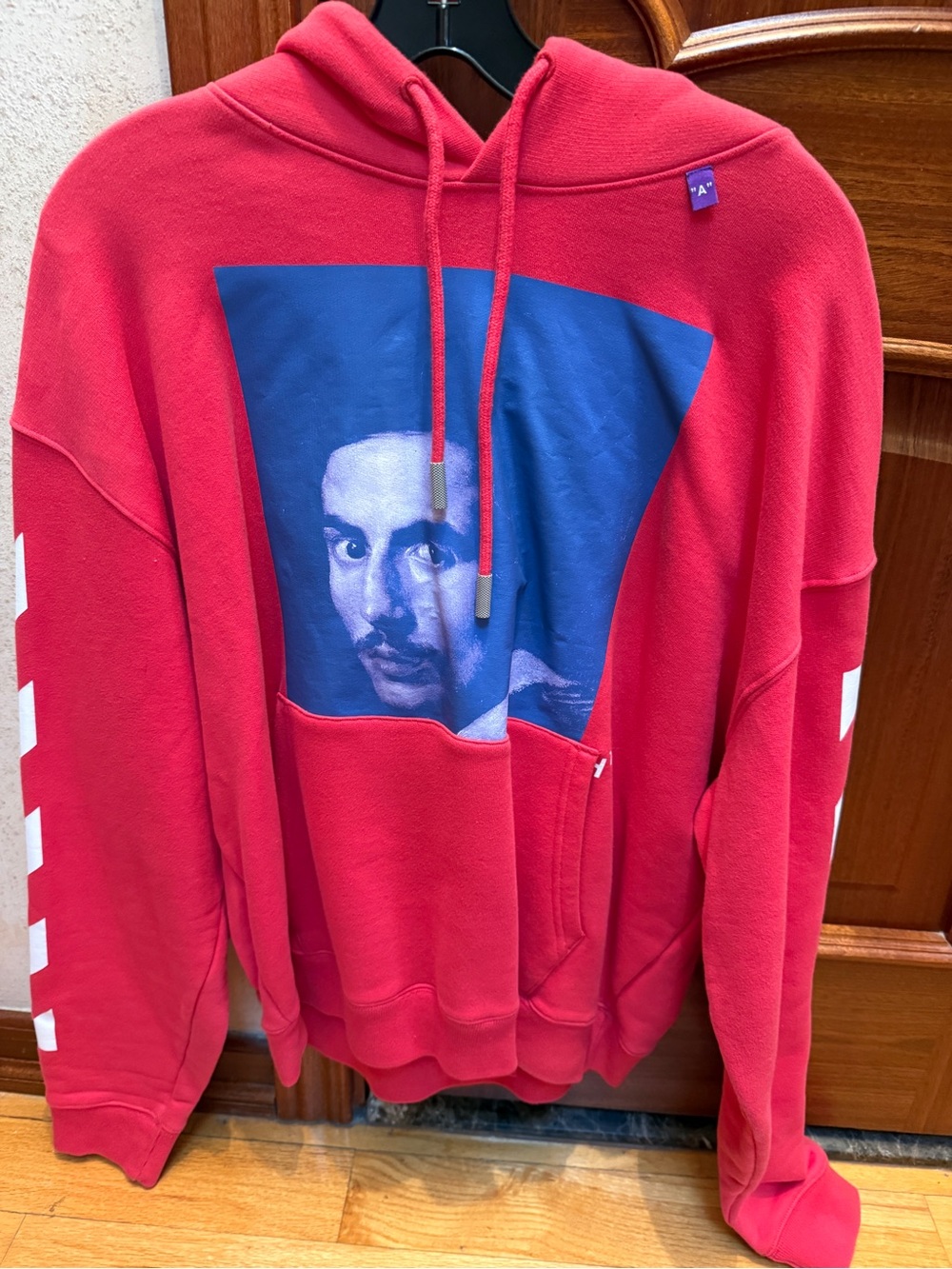 Off-White Red Pullover Hoodie with Blue Portrait Graphic